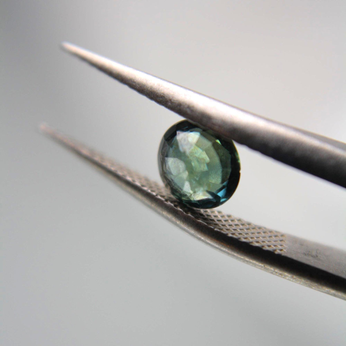 Unheated Blue-Green Sapphire Oval Gemstone | Teal Parti Sapphire (0.80 Ct)