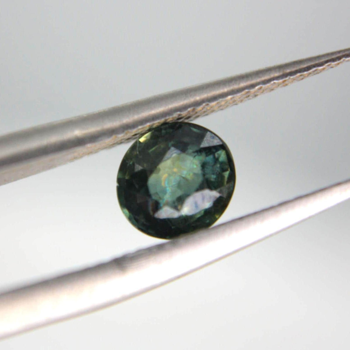 Unheated Blue-Green Sapphire Oval Gemstone | Teal Parti Sapphire (0.80 Ct)